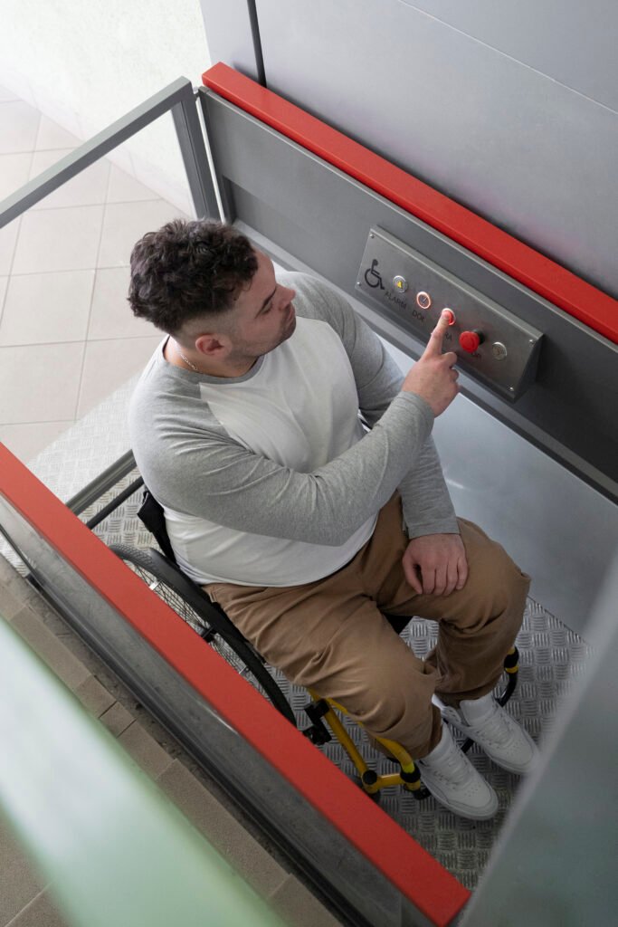 full shot man wheelchair using elevator